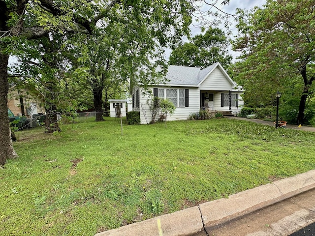 view of front of home featuring a porch and a shingled roof