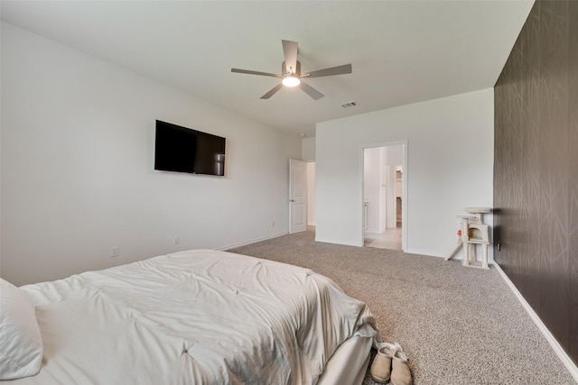 bedroom featuring visible vents, a ceiling fan, baseboards, and light carpet