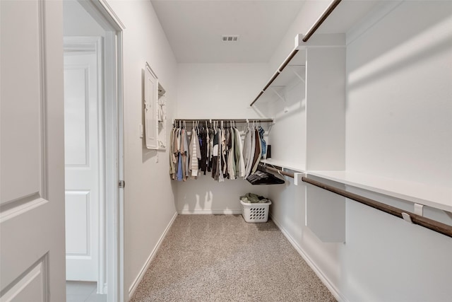 walk in closet featuring carpet floors and visible vents