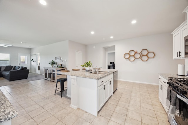 5924 Harvey Gap Ln, Denton, TX 76226 - kitchen featuring range with gas stovetop, a sink, light tile patterned flooring, dishwasher, and recessed lighting