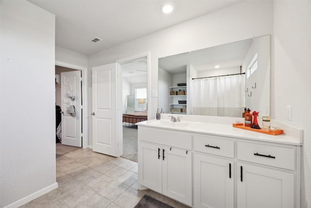 5924 Harvey Gap Ln, Denton, TX 76226 - bathroom featuring vanity, tile patterned flooring, recessed lighting, and baseboards