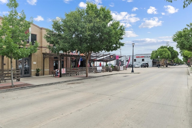 328 Alyse Rd, Roanoke, TX 76262 - view of concrete street with sidewalks, street lighting, and curbs