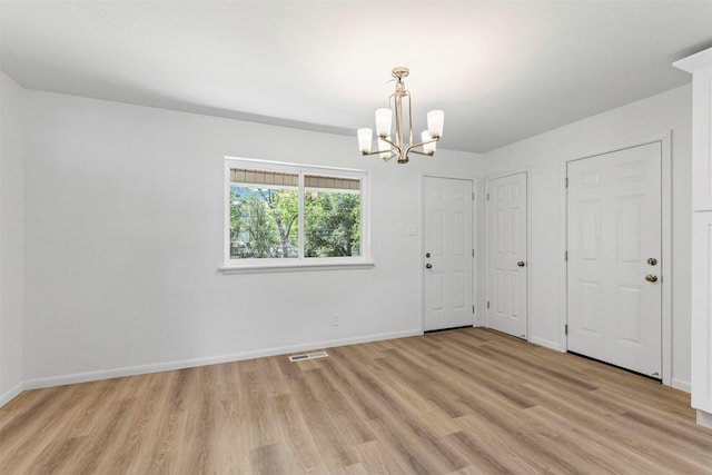 7009 Overhill Rd, Fort Worth, TX 76116 - unfurnished room featuring baseboards, visible vents, light wood-style floors, and a notable chandelier