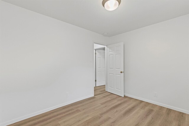 7009 Overhill Rd, Fort Worth, TX 76116 - unfurnished room featuring baseboards and light wood-style floors