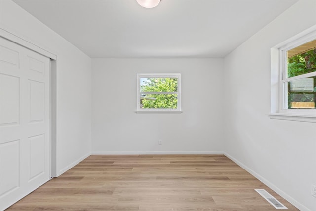 7009 Overhill Rd, Fort Worth, TX 76116 - unfurnished bedroom featuring visible vents, light wood finished floors, and baseboards