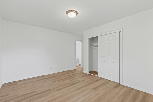 7009 Overhill Rd, Fort Worth, TX 76116 - unfurnished bedroom featuring baseboards, light wood-style floors, and a closet