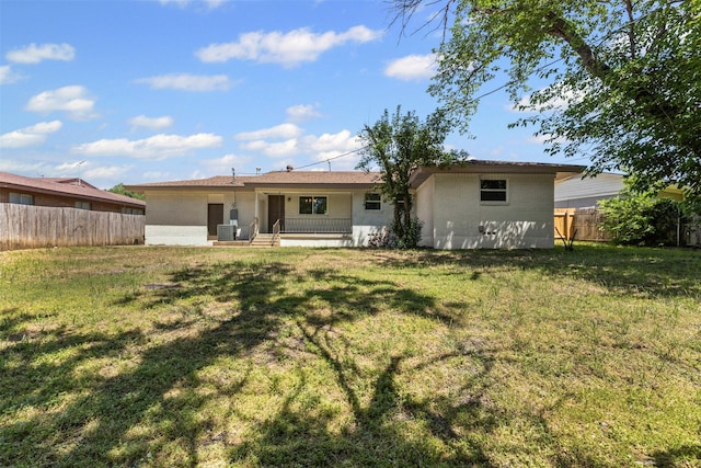 7009 Overhill Rd, Fort Worth, TX 76116 - back of property with central air condition unit, fence, a porch, and a yard