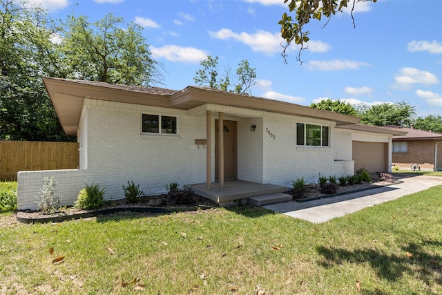 7009 Overhill Rd, Fort Worth, TX 76116 - ranch-style home featuring brick siding, a front yard, a garage, and fence