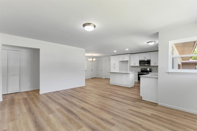 7009 Overhill Rd, Fort Worth, TX 76116 - unfurnished living room featuring a chandelier, light wood finished floors, and baseboards
