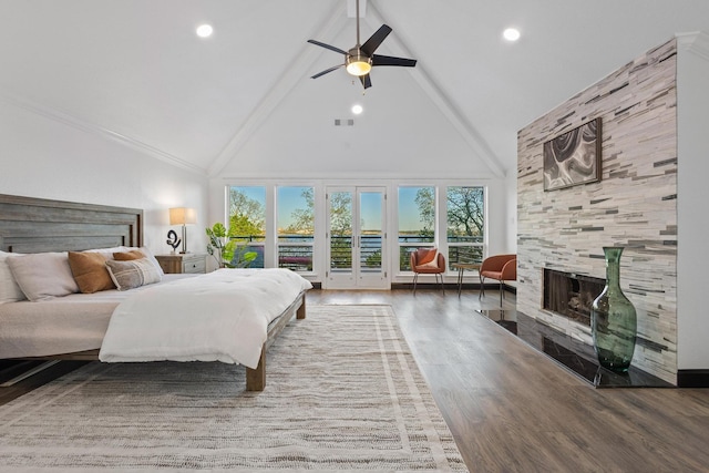 bedroom with high vaulted ceiling, a tile fireplace, access to outside, beam ceiling, and visible vents
