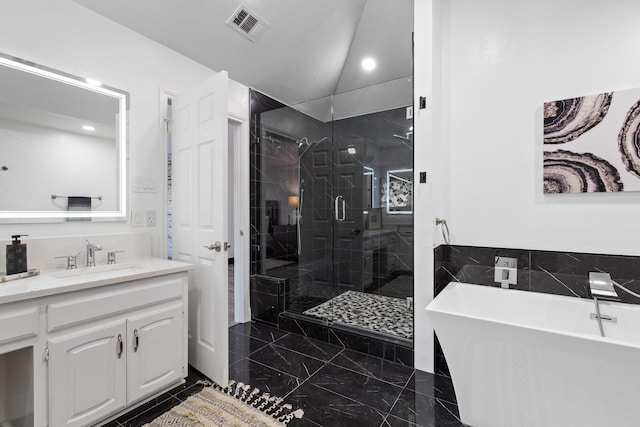 full bathroom featuring lofted ceiling, visible vents, vanity, a soaking tub, and a stall shower
