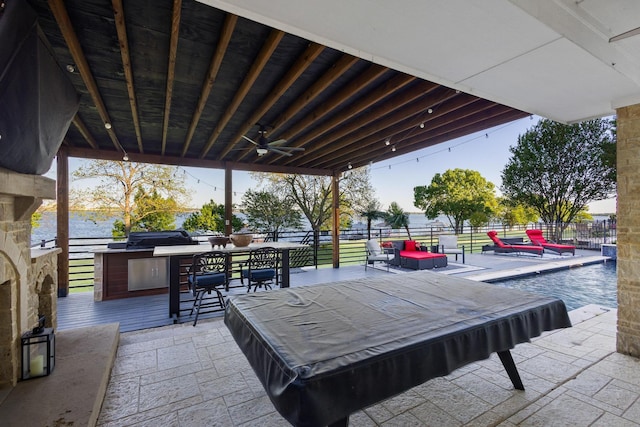 view of patio featuring fence and a ceiling fan