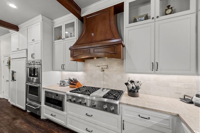 2020 Crown Knoll Ln, Plano, TX 75093 - kitchen featuring stainless steel appliances, custom exhaust hood, a warming drawer, white cabinetry, and tasteful backsplash