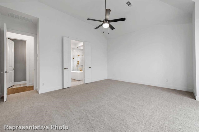 unfurnished bedroom featuring lofted ceiling, baseboards, visible vents, and carpet flooring