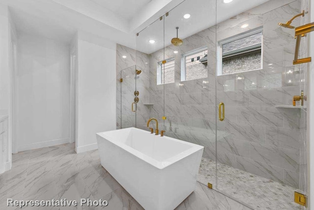 bathroom featuring recessed lighting, a freestanding tub, marble finish floor, and a marble finish shower