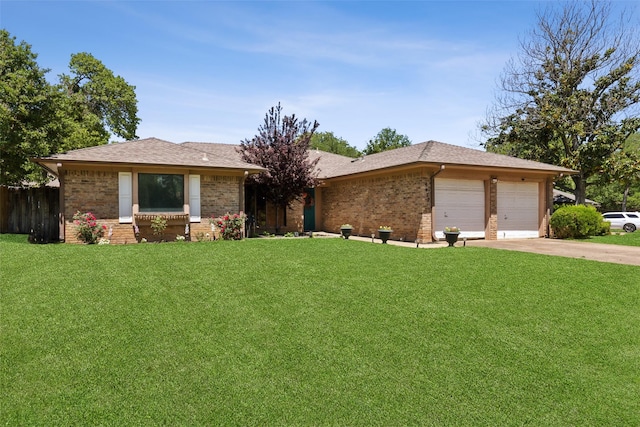 ranch-style house with an attached garage, driveway, brick siding, and a front yard