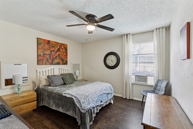 bedroom featuring a ceiling fan, a textured ceiling, and dark wood-type flooring