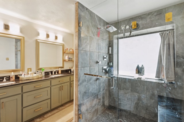 full bath featuring a sink and a stall shower