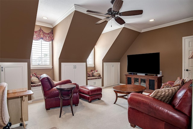 living room with plenty of natural light, ornamental molding, light colored carpet, and ceiling fan