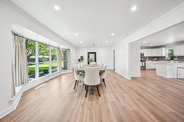 3021 Phyllis Ln, Farmers Branch, TX 75234 - dining space featuring recessed lighting, baseboards, crown molding, and light wood-type flooring