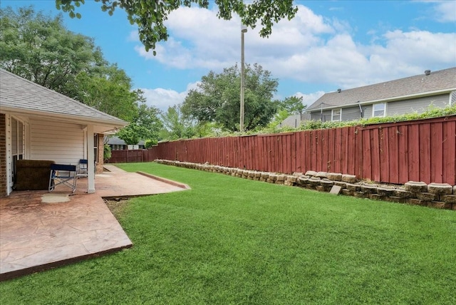 view of yard featuring a fenced backyard and a patio area