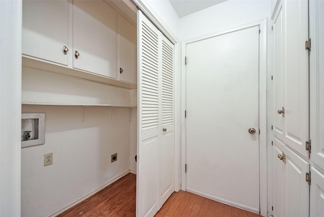 laundry room with hookup for a washing machine, light wood finished floors, cabinet space, and electric dryer hookup