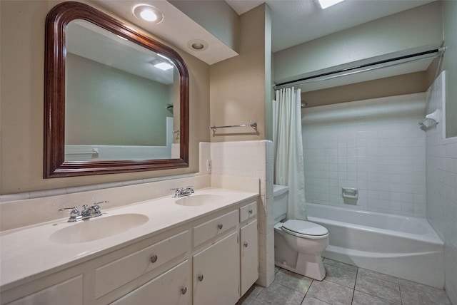 full bathroom with a sink, tile patterned flooring, shower / bath combo, and toilet