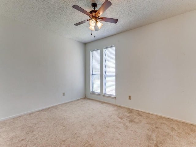 2011 Vicksburg Dr, Sachse, TX 75048 - carpeted spare room featuring a ceiling fan, baseboards, and a textured ceiling