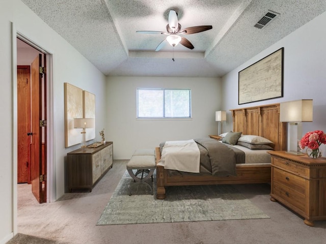 2011 Vicksburg Dr, Sachse, TX 75048 - bedroom with a tray ceiling, a textured ceiling, ceiling fan, visible vents, and light carpet
