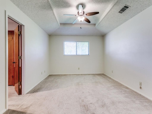 2011 Vicksburg Dr, Sachse, TX 75048 - carpeted empty room with a textured ceiling, visible vents, baseboards, a raised ceiling, and ceiling fan