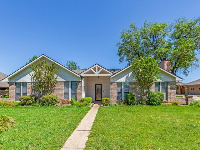 2011 Vicksburg Dr, Sachse, TX 75048 - view of front facade with brick siding and a front yard