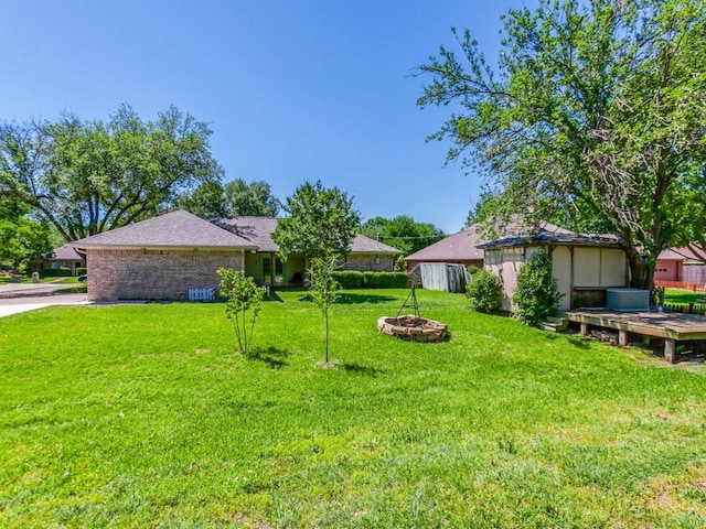 2011 Vicksburg Dr, Sachse, TX 75048 - view of yard featuring an outdoor fire pit