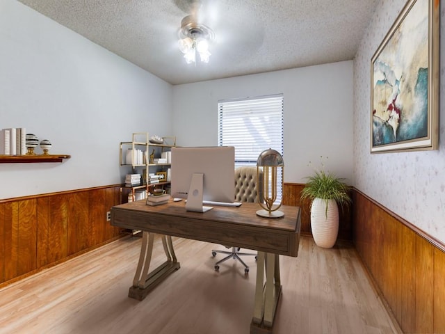 2011 Vicksburg Dr, Sachse, TX 75048 - office area with wood finished floors, a textured ceiling, ceiling fan, wooden walls, and wainscoting