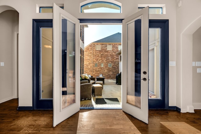 7020 Belcrest Dr, Plano, TX 75024 - doorway to outside featuring arched walkways, french doors, and wood finished floors