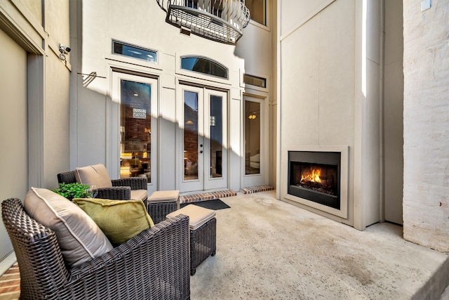 7020 Belcrest Dr, Plano, TX 75024 - view of patio / terrace featuring a warm lit fireplace and french doors