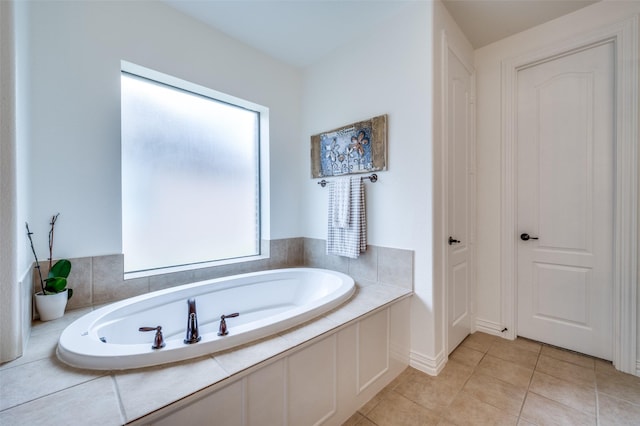 12067 Sunny St, Frisco, TX 75033 - full bathroom featuring a garden tub and tile patterned flooring