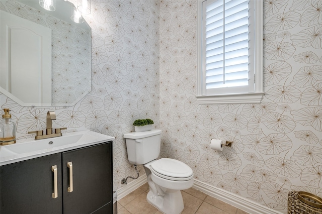 12067 Sunny St, Frisco, TX 75033 - bathroom featuring toilet, baseboards, tile patterned floors, vanity, and wallpapered walls
