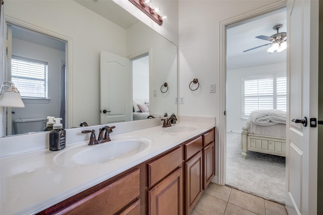 12067 Sunny St, Frisco, TX 75033 - ensuite bathroom with double vanity, tile patterned floors, healthy amount of natural light, and a ceiling fan