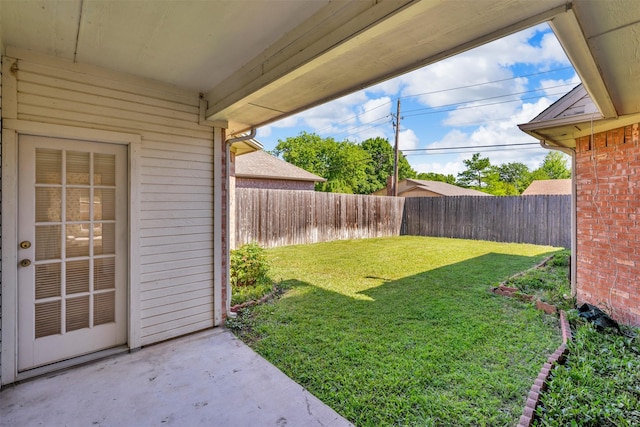 view of yard with a patio area and a fenced backyard