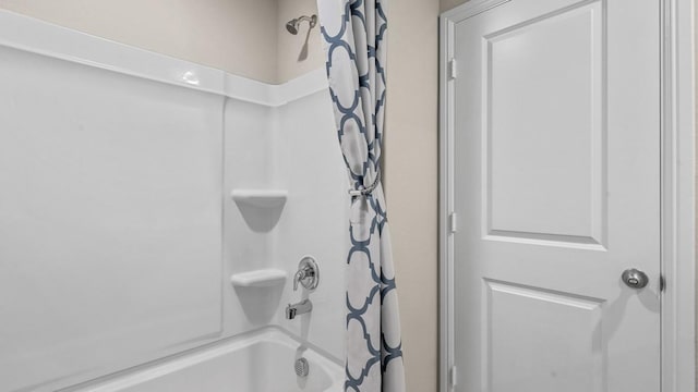 bathroom featuring shower / bath combo with shower curtain