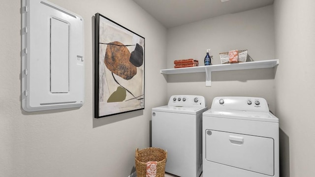 washroom featuring separate washer and dryer and laundry area