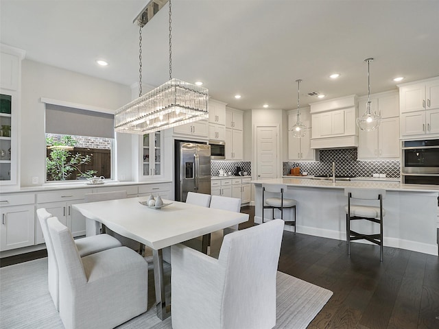 9136 Rock Daisy Ct, Dallas, TX 75231 - dining area featuring recessed lighting and dark wood-style flooring