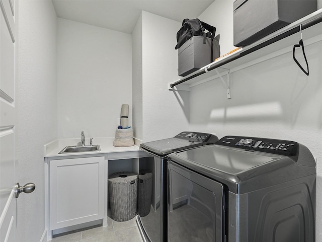 9136 Rock Daisy Ct, Dallas, TX 75231 - laundry area with cabinet space, washer and clothes dryer, and light tile patterned flooring
