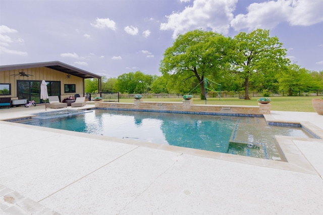outdoor pool with outdoor lounge area, a ceiling fan, fence, a yard, and a patio area