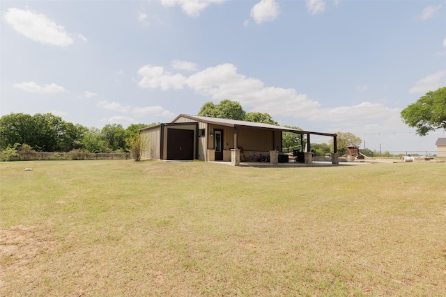 view of pole building featuring a lawn
