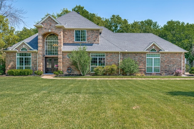 4007 Brooks Ct, Highland Village, TX 76226 - traditional home featuring a shingled roof, a front lawn, and brick siding