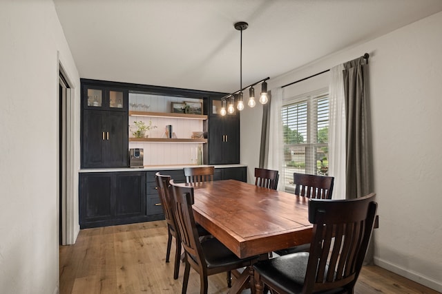1764 Brown Trl, Hurst, TX 76054 - dining space with light wood-type flooring and baseboards