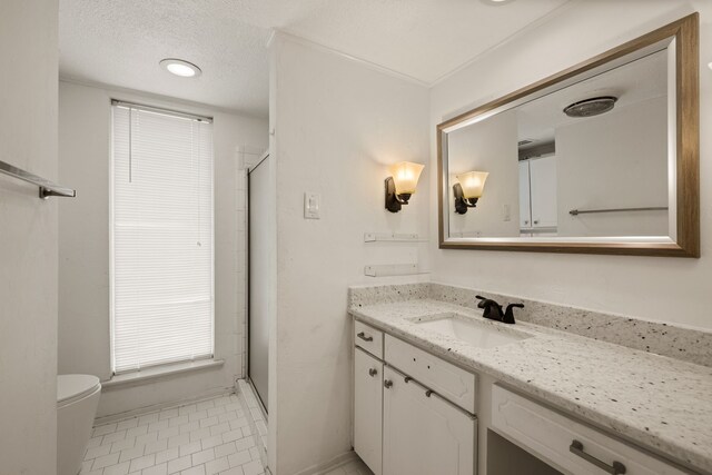 1764 Brown Trl, Hurst, TX 76054 - full bathroom featuring vanity, a shower stall, tile patterned floors, toilet, and a textured ceiling