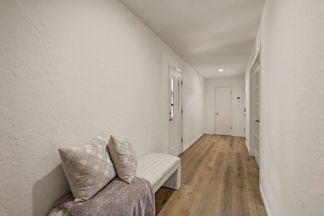 1764 Brown Trl, Hurst, TX 76054 - corridor with light wood finished floors, a textured wall, baseboards, and recessed lighting
