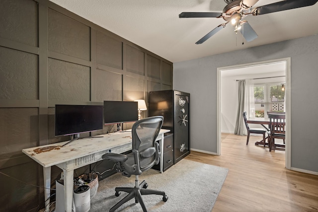 1764 Brown Trl, Hurst, TX 76054 - office area featuring light wood finished floors, baseboards, and a ceiling fan